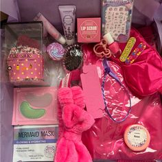 a pink box filled with lots of different items