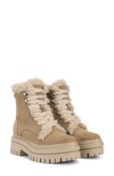 Faux-shearling trim plays up the cozy-chic vibes of a lace-up bootie lifted by a lug sole. 2" heel; 1 1/4" platform (size 8.5) 6 1/2" shaft Removable insole Leather and synthetic faux-shearling upper/synthetic lining/synthetic sole Imported Winter Lace-up Ankle Boots With Lug Sole, Lace-up Winter Boots With Suede Lining, High-top Shearling Winter Boots, Winter High-top Shearling Boots, High-top Shearling Boots For Winter, Chic High-top Combat Boots For Winter, Winter Suede Lace-up Boots, Chic Winter Boots With Lug Sole, Trendy Lace-up Boots With Lug Sole For Winter