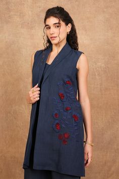 Indigo blue sleeveless blazer jacket with iris bloom embroidery and shawl lapel collar neckline. Paired with an inner bustier and a flared pant. - Aza Fashions Elegant Cotton Nehru Jacket For Spring, Sleeveless Outerwear With Floral Embroidery For Spring, Sleeveless Spring Outerwear With Floral Embroidery, Sleeveless Floral Embroidery Spring Outerwear, Sleeveless Floral Embroidered Spring Outerwear, Fitted Sleeveless Outerwear With Floral Embroidery, Fitted Sleeveless Floral Embroidered Outerwear, Cut Blazer, Sleeveless Blazer