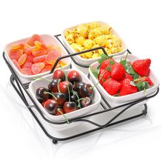 three trays filled with different types of fruits and cereal on top of each other