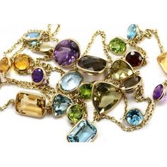 Jewelry Point - Assorted Mix Shaped Gemstone Station By The Yard Necklace 14k Gold 36", $715.00 (http://www.jewelrypoint.com/assorted-mix-shaped-gemstone-station-by-the-yard-necklace-14k-gold-36/) Multi Gemstone Necklace, Crochet Mat, 14k Yellow Gold Necklace, Joan Rivers, Beading Projects, Beaded Stretch Bracelet, Dream Jewelry, Gemstone Bracelets, Necklace Gold