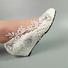 The all-white high heels are perfect for the wedding day, while the wedding shoes are made of soft fabric material, which keeps the feet comfortable. The bride shoes with flowers on top are perfect for special occasions or everyday wear, as well as a professional image. When you're looking for the perfect shoes for your big day, you want to make sure they look great and feel comfortable. Our Women's wedding shoes are perfect for any occasion, whether you're going to be walking for miles or just getting ready in the morning. With our wide selection of colors, styles, and sizes, we can't wait to help you find your perfect pair! The shoes will be shipped in 24 hours so you will get it on time. Our store has all kinds of cheap wedding shoes that you can choose from, such as high heels, wedges, Pearl White Wedding Shoes For Bridal Shower, Elegant Low Heel Lace Wedding Shoes, Elegant Lace Wedding Shoes With Low Heel, Lace Low Heel Wedding Shoes, White Closed Toe Court Shoes, Lace Closed Toe Wedding Shoes For Formal Occasions, Formal Lace Wedding Shoes With Pointed Toe, Formal Lace Wedding Shoes With Closed Toe, White Round Toe Court Shoes For Party