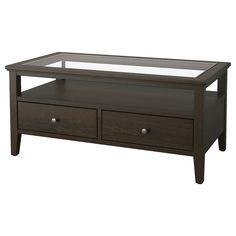 a coffee table with two drawers and a glass top on it's bottom shelf