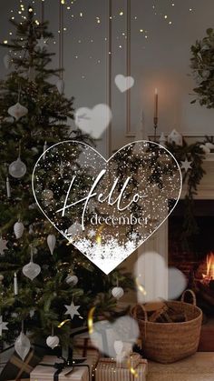 a christmas tree and presents in front of a fireplace with the words hello december written on it