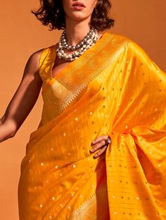 Wear this designer saree with amazing trending zari weaving work to create fashion statements. This yellow saree can be adorned at festivals and events. Made with yellow color silk material, it exudes elegance and charm. The zari weaving work adds a touch of traditional beauty to the saree, making it perfect for wedding ceremonies, cocktail parties, festivals, and marriages.
The saree comes with attached tassels, enhancing its overall appeal. The matching yellow color silk material blouse with z Yellow Pre-draped Saree For Festivals, Yellow Dola Silk Pre-draped Saree For Navratri, Pre-draped Saree For Puja Festivals, Yellow Handloom Pre-draped Saree For Navratri, Yellow Handloom Pre-draped Saree For Wedding, Festive Yellow Tussar Silk Pre-draped Saree, Yellow Tussar Silk Pre-draped Saree For Diwali, Gold Pre-draped Saree For Puja And Festivals, Yellow Katan Silk Pre-draped Saree