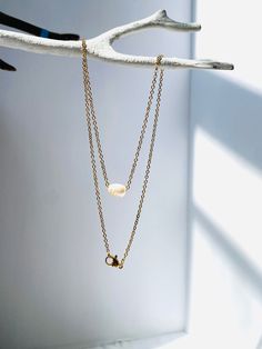 Indulge in the simple elegance of our Freshwater Pearl necklace. The genuine pearl dangles delicately on a gold 16” non-tarnish stainless steel chain, adding a touch of sophistication to any outfit. Perfect for layering, or worn alone, this dainty charm exudes luxury and refinement. Minimalist Pearl Charm Necklace With Delicate Chain, Minimalist Gold Charm Necklace With Pearl, Everyday Minimalist Teardrop Pearl Necklace, Everyday Pearl Drop Dangle Necklace, Dainty Charm Necklace With Pearl Pendant, Dainty Charm Necklaces With Pearl Pendant, Gold Minimalist Charm Necklaces With Pearl Chain, Dainty Pearl Drop Dangle Charm Necklaces, Minimalist Gold Pearl Charm Necklaces