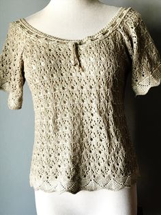 "Lovely KNITTED BEIGE DIRNDL TOP  with Short Sleeves Raglan Styles Interesting Knitting Pattern with various openings a Knitted Cord is woven in and out around the wide neckline by \"ST PETER TRACHTEN, AUSTRIA\" 67% Cotton/33% Polyacryl No Size label Actual Measurements are: armpit to armpit: 17\" (34\" bust) length: 20\" An airy, light top VINTAGE, in excellent condition" Hand Knitted Cream Knit Tops, Cream Hand Knitted Top, Beige Hand Knitted Tops, Cream Crochet Knit Top, Knitted Cord, St Peter, Cute Comfy Outfits, Top Vintage, Size Label