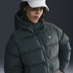 Up your outerwear game in this insulated puffer jacket. A loose fit makes it ideal for layering while the Nike Therma-FIT technology helps manage your body’s natural heat to help keep you warm in cold-weather conditions. A water-repellent finish, bungees at the hem and a hood work together to help shield you from wind and rain. Green North Face Puffer, Green Puffy Jacket, Green North Face, Nike Puffer, North Face Coat, Jacket Nike, Wind And Rain, Puffy Jacket, Nice Clothes