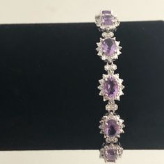 This Bracelet Is Beautiful! Sterling Silver With Gorgeous Purple Amethyst Stones And 1/4 Ct Diamond Accents. 14 Ct Purple Amethyst 1/4 Ct Diamond Accents Set In Sterling Silver Length - 7.5” Box Safety Clasp Gift Box Ae-N15-K Amethyst Stone, Purple Amethyst, Sterling Silver Bracelets, Silver Bracelet, Amethyst, Sterling Silver, Stone, Purple, Silver