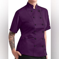 Women’s Tailored Button Down Chef Coat With Piping. Color Is A Gorgeous Eggplant Purple. Chef Coat Has A Stand-Up Mandarin Style Collar And An Adjustable Back Tie Belt. Both Features Add A Nice Touch Of Professionalism To The Coat. Most Importantly The Chef Coat Has 2 Side Pockets!! Best Part Of The Chef Coat In My Opinion. Super Easy To Clean! Just Machine Wash And Tumble Dry. Can Iron If Needed. Material Is A Blend Of 65% Polyester And 35% Cotton. Coat Feels Comfy And Is Too Heavy. Comfortable Purple Button-up Outerwear For Work, Purple Button-up Outerwear With Button Closure, Purple Button-up Outerwear, Purple Buttoned Workwear Outerwear, Purple Buttoned Outerwear For Work, Purple Outerwear With Button Closure For Work, Purple Workwear Tops With Pockets, Purple Buttoned Tops For Work, Purple Office Tops With Buttons