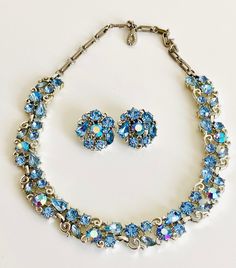 "Vintage LISNER Baby Blue Rhinestones Earring and Chocker Necklace Set in excellent vintage condition, marked Lisner.  Measures  Choker 17\" long by .5\"  wide  Earrings 1\" in diameter  All items come from a smoke and pet free home.   Please note! We endeavor to make our customers as happy as possible. This item is Vintage and we do our best to describe items as accurately as possible.   We are happy to combine shipping on multiple purchases! Just email me and let me know you are still shopping Vintage Necklaces Blue Rhinestones, Blue Costume Jewelry For Anniversary, Vintage Crystal Jewelry With Matching Earrings, Vintage Light Blue Jewelry For Wedding, Vintage Light Blue Wedding Jewelry, Light Blue Vintage Wedding Jewelry, Vintage Blue Jewelry For Wedding, Vintage Blue Necklace For Anniversary, Vintage Blue Wedding Jewelry