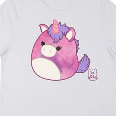 Hang out with your favorite unicorn with this Squishmallows tee. The shirt features an image of Lola the Unicorn sitting next to purple letters that spell out her name. The tee comes in a white short sleeve crew neck. Squishmallows fans will love this comfy cotton t-shirt. Purple Short Sleeve Kawaii T-shirt, Purple Kawaii Short Sleeve T-shirt, Purple Cartoon Print Fun T-shirt, Purple Graphic Print Kawaii T-shirt, Purple Kawaii T-shirt With Graphic Print, Kawaii Purple T-shirt With Graphic Print, Purple Crew Neck T-shirt In Kawaii Style, Playful Purple T-shirt With Graphic Print, Playful Purple Graphic Print T-shirt