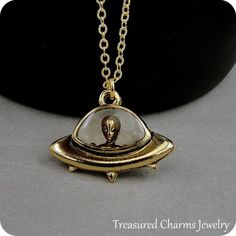 This UFO with Alien Necklace comes on a gold-plated chain that is available in different lengths. Please choose your desired length from the drop-down menu when placing the item in your shopping cart. { CHARM DETAILS }★ Material: Pewter ★ Finish Color: Gold★ Measurements: 7/8" x 1-1/4"★ Dimensions: One-sided★ Made in the USA{ SIMILAR ITEMS } More UFO themed items available from my shop: https://www.etsy.com/shop/treasuredcharms/search?search_query=alien{ GIFT OPTIONS}Gift boxes are available at Space-themed Gold Jewelry Gift, Gold Spaceship, Spaceship Necklace, Alien Necklace, Alien Gift, Alien Spaceship, Pandora Beads, Gold Charm Necklace, Mens Gold