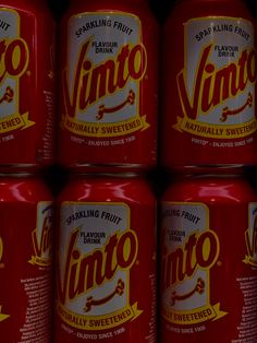 six cans of tino sitting next to each other