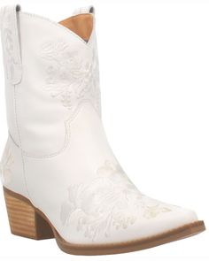 a white cowboy boot with embroidered flowers on the side