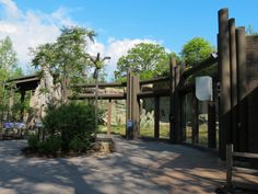 the entrance to an animal park with trees in the background