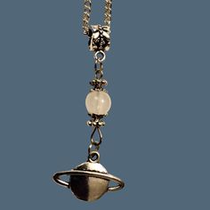 This Planet Saturn Charm Necklace Is A Unique Piece Of Space-Themed Jewelry. It Features A 26-Inch Silver Metal Chain With A Beautiful Saturn Charm, Perfect For Astronomy Enthusiasts. Silver Metal Chain (26 Inches) Planet Saturn Charm Space-Themed Design Condition: New With Tags Ships Same Or Next Day Saturn Charm, Charm Ideas, Saturn Planet, Planet Saturn, Room Stuff, Phone Charms, Space Theme, Themed Jewelry, Phone Charm