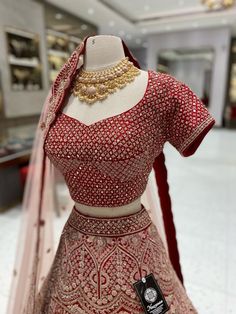 Indulge in luxury with our Bright Red Bridal Lehenga BL-106. Expertly crafted with premium materials, this stunning lehenga exudes elegance and sophistication. Its bright red color will make you stand out on your special day, while the intricate details and design will leave you feeling like royalty. Elevate your bridal look with our BL-106 lehenga. Fabric: Raw Silk! WASH CARE INSTRUCTIONS - Please Dry clean only when it is applicable! Ready to Ship! Formal Resham Embroidered Lehenga For Festivals, Formal Resham Embroidery Lehenga For Festivals, Formal Lehenga With Zari Work For Navratri, Formal Navratri Lehenga With Zari Work, Formal Lehenga With Dupatta For Navratri, Formal Festive Lehenga With Traditional Drape, Formal Lehenga With Intricate Embroidery For Festive Occasions, Bollywood Style Formal Choli For Navratri, Traditional Red Semi-stitched Gown