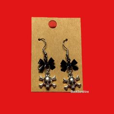 Beautiful skull and bow dangle earrings Please refer to images for measurements and other details Skull Crossbones, North Las Vegas, Emo Goth, Skull And Crossbones, Etsy Earrings Dangle, Black Bow, Jewelry Earrings Hoops, Las Vegas, Dangle Earrings