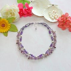 "Double Strands Short Amethyst in Different Shapes, and Freshwater Pearls Necklace. Necklace Length: 17.5 \" L;  Extender: 1.5\" L. Material: 4-6mm purple Crystals, 6mm round-shaped genuine amethyst, 11mm barrel-shaped amethyst, 7-8mm potato-shaped Freshwater Pearl, and freeform amethyst. Clasp: 925 sterling silver lobster claw clasp and extender. Workmanship:  Each bead is hand-beaded. https://www.etsy.com/shop/MYGEMSROCK" Necklace Amethyst, Double Strand Necklace, Pearls Necklace, Amethyst Jewelry, Lovely Necklace, Jewelry Gemstone, Purple Crystals, Freshwater Pearl Necklaces, Strand Necklace