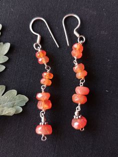 Carnelian gemstone beaded silver earring, earring gift for her, carnelian faceted rondelle beads earrings, boho earring, every day earrings, gift for daughter, gemstone beaded sterling silver earrings hand made with love and passion. Item: carnelian earring pair Metal: sterling silver Metal purity: 92.5% Length: 6.25 cm Sterling Silver Gemstone Bead Earrings, Silver Gemstone Bead Round Earrings, Silver Round Gemstone Bead Earrings, Silver Gemstone Beads Earrings, Sterling Silver Earrings With Round Gemstone Beads, Elegant Gemstone Beaded Earrings For Gift, Sterling Silver Gemstone Beads Dangle Earrings, Bohemian Gemstone Beads Earrings, Sterling Silver Dangle Earrings With Gemstone Beads