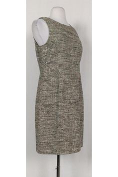 Look sleek and stylish in this black & cream tweed dress. It is a great transitional piece that can be worn from work hours to cocktail hour. Size 8 Knit textured fabric Rounded neckline Sleeveless Fitted at waist Unlined Above knee Bust 34" Waist 31" Shoulder to hem 34" Elegant Sleeveless Tweed Dress For Formal Occasions, Fitted Sleeveless Tweed Dress For Formal Occasions, Sleeveless Tweed Dress For Formal Occasions, Formal Sleeveless Tweed Dress, Sleeveless Tweed Formal Dress, Chic Sleeveless Tweed Dress For Office, Formal Fitted Beige Tweed Dress, Elegant Sleeveless Beige Tweed Dress, Formal Fitted Sheath Tweed Dress