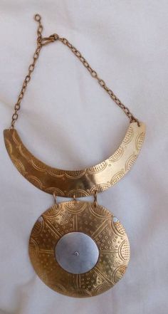 African women necklace. The necklace is well handcrafted using brass. Gift for her **This listing is for one necklace.** Custom orders are welcome. For more necklaces:- https://www.etsy.com/listing/907446756/african-women-neckace-pendant-choker?ref=shop_home_active_35 Dhl shipping express **Happy shopping!   Thankyou for visiting. Gold-tone Brass Round Pendant Necklace, Handmade Brass Gold-tone Necklace, Handmade Brass Necklace In Gold-tone, Handmade Gold-tone Brass Necklace, Vintage Copper Necklaces, Gold-tone Brass Necklace With Large Pendant, Long Bronze Brass Necklace, Handmade Brass Chain Necklace, Unique Gold-tone Brass Necklaces