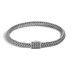 This classic chain bracelet from John Hardy is sure to become your next jewelry staple. Crafted from sterling silver, this bracelet features beautiful strands that are woven together for a rope like feel. Because of its simple design, this bracelet can be worn by itself or stacked with other pieces for an on-trend look. The bracelet measures 5mm in width and fits a wrist that measures 6 - 6.5 inches. John Hardy Style#: BB96CXM Classic Sterling Silver Clasp Bangle Bracelet, Classic Sterling Silver Bangle Chain Bracelet, Classic Silver Braided Bracelet With Box Chain, Classic Bangle Chain Bracelet With Sterling Silver Clasp, Elegant Round Sterling Silver Braided Bracelets, Classic Braided Bracelet With Sterling Silver Clasp For Gift, Classic Braided Bracelet With Sterling Silver Clasp, Elegant Braided Sterling Silver Bracelet Gift, Classic Sterling Silver Jubilee Bracelet