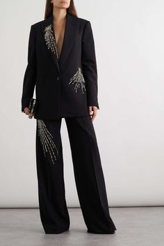 Step into elegance and sophistication with our exquisite Black Suit Women 2pc Hand Embroidered Peak Lapel Pant Blazer Set. This timeless ensemble is the epitome of class, designed to make a statement at any formal occasion, whether it be at the office or a lavish dinner party. Crafted with meticulous attention to detail, this luxurious outfit features a tailored blazer and matching pants. The peak lapel of the blazer exudes confidence, while the hand embroidery adds a touch of intricate charm, setting you apart from the crowd. The rich black hue exudes timeless grace, lending a sense of power and authority, perfect for commanding attention and leaving a lasting impression. The blazer's structured silhouette enhances your figure, exuding femininity with a hint of boldness. The impeccably cr Chic Embellished Party Suit, Chic Evening Suit Embellished, Chic Embellished Evening Suit, Elegant Fitted Embellished Pantsuit, Luxury Embellished Party Suit, Elegant Suits For Gala Party, Elegant Embellished Party Suits, Luxury Sequin Party Sets, Elegant Gala Party Suits