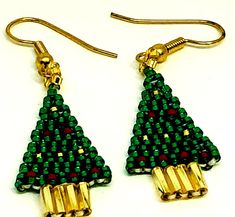 Handmade Green Christmas Tree Earrings
The Handmade Green Christmas Tree Earrings features the following: 11o green delica seed beads11o gold delica seed beads11o red delica seed beadsgold bugle beadsgold plated ear wiresThese beautiful Handmade Green Christmas Tree Earrings are for the woman who loves to stand out in a crowd.  You will be sure to attract many admirers with during the holiday season.
Don't you love these beautiful Christmas tree earrings?  Whether you are going out for a night o Christmas Earrings Diy, Beaded Christmas Earrings, Christmas Beaded Earrings, Christmas Jewerly, Beaded Tutorials, Diy Christmas Earrings, Christmas Beads Craft, Beaded Ornaments Diy, Xmas Jewelry