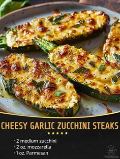 grilled cheesey garlic zucchini steaks on a plate with basil leaves