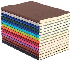 a stack of books sitting on top of each other in front of a white background