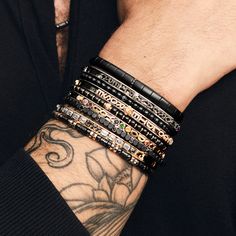 Elevate your fashion game with this Stretch Carbon Fiber Bracelet. Featuring five rows of black diamonds, black ceramic and carbon fiber beads all seamlessly integrated into a stretchable design, this piece adds a contemporary edge to any style. Available in 18K White, Yellow, and Rose Gold Black Diamond weight = 0.40 carats Wrist Sizes: L = 7in to 7.5in XL = 7.5in to 8in XXL = 8in to 8.5in Please contact us for custom sizes Luxury Black Bracelets, Luxury Adjustable Black Wristband, Luxury Black Bracelet Jewelry, Luxury Rose Gold Beaded Bracelets, Luxury Black Bracelet Strap Jewelry, Luxury Black Jewelry Bracelet Strap, Luxury Black Jewelry With Bracelet Strap, Luxury Black Adjustable Beaded Bracelet, Luxury Adjustable Black Jewelry