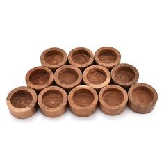 a pile of wooden bowls sitting on top of each other