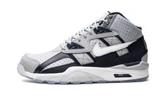 The Nike Air Trainer SC High “Georgetown” is a collegiate-inspired colorway of the retro cross trainer worn by former baseball and football player Bo Jackson back in the day.  The Air Trainer SC High “Georgetown” was released in June 2021 by Nike and its colorway is inspired by the school colors of the Georgetown Hoyas.  The shoe’s perforated upper is designed in versatile Cool Grey leather.  Contrasting Obsidian-colored leather panels are found throughout the look, including on the heel overlay Bo Jackson Sneakers, Bo Jackson Shoes, Nike Air Max White, Bo Jackson, Jordan Shoes Retro, Nike Brand, Mens Nike Air, Nike Basketball, Nike Jordan