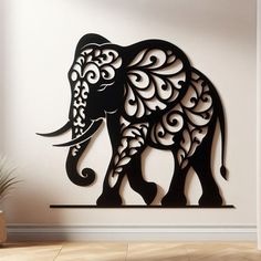 an elephant made out of metal on the wall