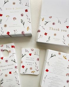 wedding stationery with flowers on them and thank you notes attached to the front cover