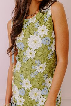 - Let your style bloom into a floral fantasy with this adorable dress! - Fully lined floral crochet material featuring white, yellow, and blue hues - A round neckline - A sleeveless cut - A cutout detail on the back - Side zip closure - A flattering silhouette that ends in an uneven mini dress length hemline Green Floral Applique Summer Dress, Green Floral Applique Dress For Summer, Spring Floral Applique Beach Dress, Spring Beach Dress With Floral Applique, Green Sleeveless Dress With Lace Patchwork, Green Dress With Lace Trim For Garden Party, Spring Green Crochet Lace Dress, Summer Crochet Lace Dresses For Garden Party, Spring Multicolor Crochet Lace Dresses