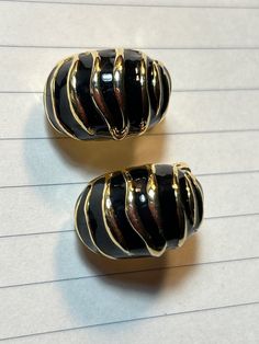 Vintage Clip on earrings in black and gold.  Conch Shell shape Heavy clip on is in good shape Vintage Clip On Earrings, Gold Clips, Conch Shell, Vintage Clip, Art Accessories, Jewelry Inspo, Conch, Black And Gold, Clip On