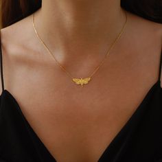 "Enter the enchanting world of the nocturnal with our Moth Necklace for the holiday season. This piece isn't just a necklace; it's a tribute to the mysterious and delicate beauty of moths, making it a sought-after item in the realm of Moth Jewelry. The intricate details on the Moth Wings Necklace capture the essence of moonlit nights and the quiet flutter of wings, ensuring you're not just wearing a piece of jewelry, but a captivating story. Immerse yourself in a world of gothic allure and let your style soar this holiday season. PRODUCT DETAILS: * Choose of Material: 925 Sterling Silver, 14K Solid Gold (real solid gold, no gold-filled or no gold plated material) * Choice of Gold Color: Yellow Gold, Rose Gold, White Gold * Closure: Spring ring * Chain style: Cable * Style: Minimalist M O R Insect Jewelry Gold, Location Names, Moth Ring, Insects Jewelry, Moth Jewelry, Moth Pendant, Dangle Cross Earrings, Moth Necklace, Insect Necklace