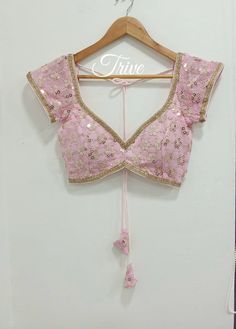 This Made to Order/Made to Measurement/Custom Made Indian Ethnic Blouse. - Fabric - Mirror Work Georgette - Color - Pink  - Princess Cut - Rich Lined - Sleeveless - Extra margin and extra stitches included in the blouse - It can be customize in any color, design or size  MEAUREMENTS & CUSTOMIZATIONS This blouse can be purchased in your standard sizing and pattern. Please choose your Chest Size (measured in inches) from the drop-down box.. For custom sizing please include the below measurements in the the notes to whenever you placed the order. * Chest size: * Waist size: * Blouse Length: * Bicep: * Arm-hole: * Sleeve Length: * Front Neck Depth: * Back-Neck Depth:  Sleaves Around PLEASE NOTE: BUYERS ARE RESPONSIBLE FOR ANY CUSTOMS AND IMPORT TAXES THAT MAY APPLY. This is a made to order pro Lehenga Blouse Designs Front Neck, Short Sleeve Lehenga Blouse, Dark Pink Blouse Designs For Saree, Cut Sleeve Blouse Design, Corset Style Blouse, Traditional Tops With Gota Work For Navratri, Traditional Navratri Tops With Gota Work, Fitted Bohemian Designer Blouse, Bohemian Pink Blouse With Traditional Drape