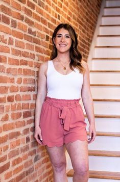 This bodysuit should be a staple in everyone’s wardrobe! Ribbed knit with wide straps, front V neck, scoop back, and thong bottom is the perfect basic stretchy bodysuit to mix and match with any skirt, shorts, pants, or jeans imaginable. Material: 92% NYLON 8% SPANDEX Size: OS one size Summer High Waist Tie Waist Shorts, Summer High-waisted Shorts With Tie Waist, Feminine Shorts With Elastic Waistband For Day Out, Feminine Short Length Bottoms For Brunch, Feminine High-waist Summer Shorts, Feminine High Waist Summer Shorts, Feminine High-waisted Shorts For Summer, Spring High-waisted Tie Waist Shorts, Summer Style Bottoms With Tie Waist For Brunch