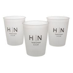 three white cups with the words hn on them