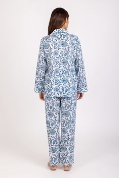 DESCRIPTION: Welcome to our collection of cute and stylish lightweight cotton hand block printed PJ sets. Made with the finest cotton, these sets are designed to provide ultimate comfort and style for your relaxing evenings. With a button-up front, collared neckline, and long sleeves, you'll look effortlessly chic while enjoying a cozy night's sleep. The single accent patch pocket adds a touch of uniqueness to the design, making our PJ sets stand out from the rest. Get ready to feel cute and com Printed Cotton Sleepwear For Pajama Party, Cotton Floral Print Loungewear Set, Cotton Floral Print Home Sets, Cotton Floral Print Bedtime Sets, Printed Relaxed Fit Sets For Home, White Printed Sets For Daywear, Blue Printed Cotton Sleepwear, Long Sleeve Sets With Printed Motifs For Loungewear, Floral Print Cotton Pant Set With Long Sleeves