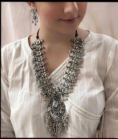 Add style and charisma to your beautiful personality with this exquisitely designed and handcrafted German Silver and oxidised alloy necklace .Pair it up with any casual, semi formal or, formal attire and gather compliments for your unique and classy choice. Ideal wear for both casual and dressy occasions Length 28-30 inches with an adjustable black dori at the back Weight 154 GM's Earrings are lightweight Note: All in stock items will be shipped from New Delhi, India within 2-3 business days af Oxidised Jewelry, Oxidised Necklace, Oxidized Silver Necklace, Necklace Set With Earrings, Traditional Indian Jewellery, Temple Jewelry, Oxidized Necklace, Silver Necklace Set, Traditional Earrings