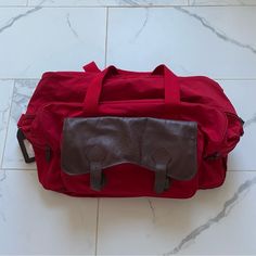 Original 90s Marlboro Bag Good Condition, Few Small Flaws Shown Has Original Luggage Tag Unused Casual Red Satchel With Large Capacity, Casual Burgundy Satchel For Travel, Red Canvas Bag With Pockets, Retro Red Satchel For Everyday Use, Casual Red Bag With Luggage Sleeve, Red Satchel Bag With Pockets, Casual Red Satchel For School, Casual Burgundy School Bag, Red Rectangular Canvas Bag With Pockets