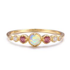 Crafted to give you that positive celestial vibe - the ring has the Opal daintily sited and beaming like a full moon, while gravitating towards the pink Tourmaline and white topaz to give you a supernatural sparkle. METALS 14k Yellow Gold Vermeil: The base metal is ethically-sourced nickel-free 925 Sterling Silver (perfect for sensitive skins). We add three layers of 14K gold/ rose gold or white gold, which gives your jewelry that extra, sparkly shine and adds durability to prevent oxidization. Birthstone Engagement Rings, Gold Vermeil Jewelry, Zierlicher Ring, Vintage Style Rings, Stacked Jewelry, Vermeil Jewelry, Tourmaline Ring, Gemstone Engagement Rings, October Birth Stone