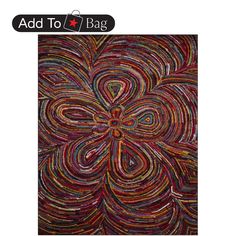 a colorful rug with an abstract design on it