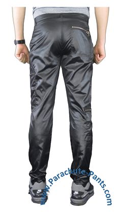 Awesome nylon Countdown Parachute Pants will bring you back to the 80s in no time. Break dancing is optional, and pockets are plentiful. You’ll be making a swooshing noise when you walk. These Countdown Parachute Pants have a tight fit and shiny finish that will really get you noticed. The pants come with two zippered pockets on the right leg and one zippered pocket on the left leg, along with two front zippered pants pockets and one zippered back pocket. There are also zippers at the bottom of Nylon Pants With Zip Fly For Outdoor, Nylon Outdoor Pants With Zip Fly, Fitted Black Nylon Parachute Pants, Fitted Pants With Zip Fly For Outdoor, Nylon Parachute Pants With Hip Pockets, Fitted Nylon Parachute Pants With Cargo Pockets, Fitted Nylon Bottoms With Hip Pockets, Fitted Nylon Cargo Pants For Streetwear, Stretch Nylon Techwear Parachute Pants