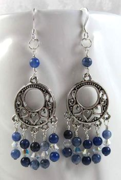 the earrings are made from silver and blue beads